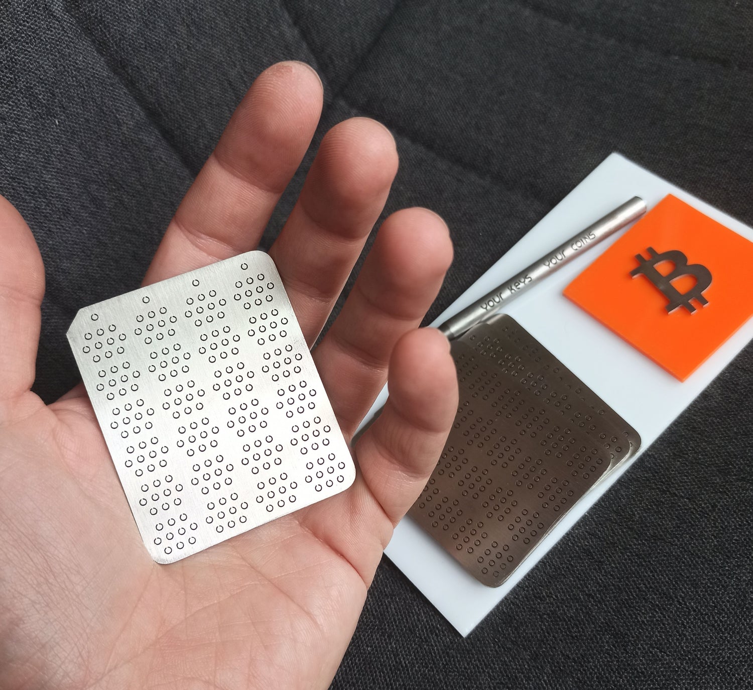 MiCrypt bare stainless steel Bitcoin seed phrase backup plate – in hand. Custom encrypted with no visible words, numbers or branding. Best solution. 
